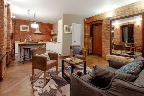 Một căn hộ với tông màu vàng nâu ấm áp với những bức tường gạch thô tạo điểm nhấn cho toàn bộ căn hộ. 